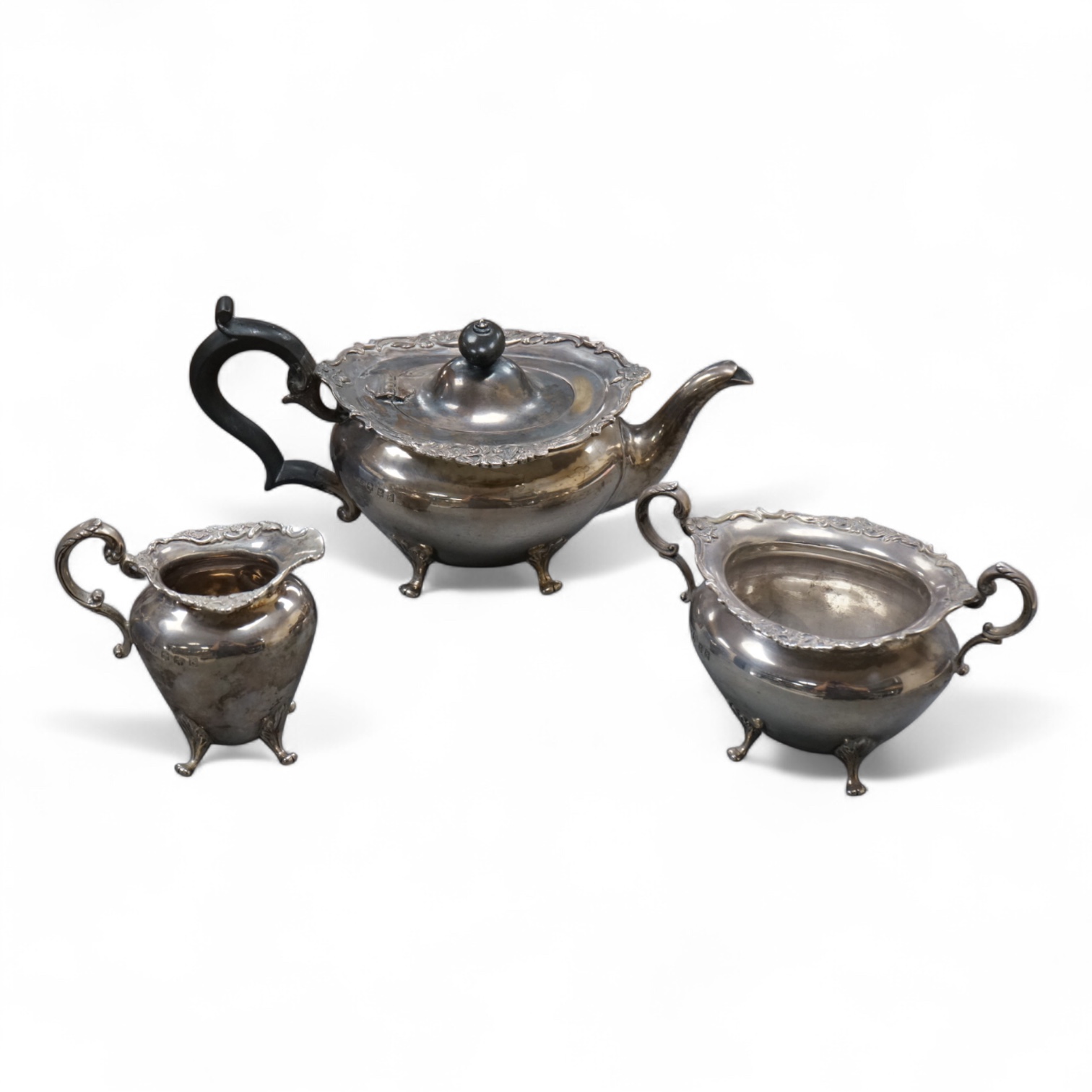 An Edwardian Scottish silver three piece oval tea set by Weir & Sons, Glasgow, 1901, gross 25.5oz, with foliate borders.